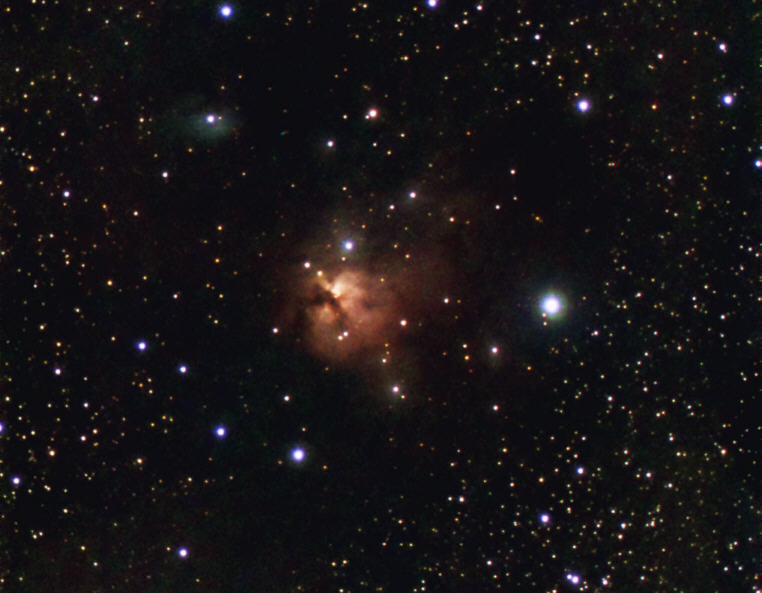 The reddish emission nebula NGC 1579 and the blue reflection nebula IC 2067 (top left) shine from a dark nebula in the constellation Perseus